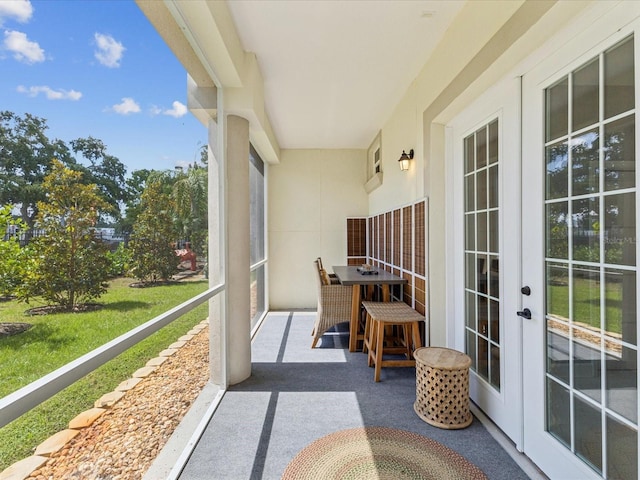 1340 Bayshore Blvd Unit 502, Dunedin, FL 34698 - sunroom / solarium featuring french doors and plenty of natural light