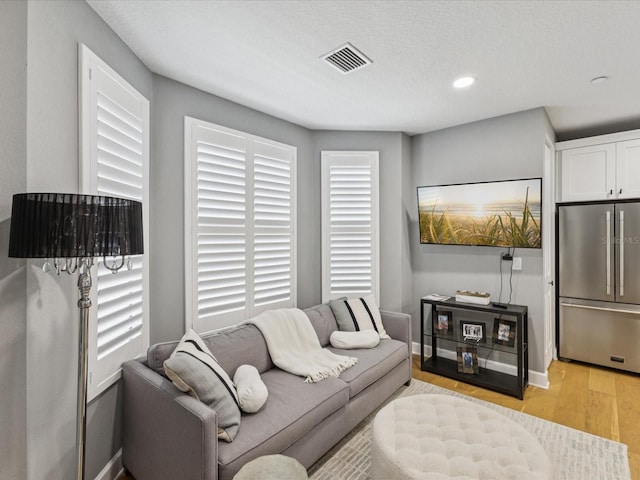 1340 Bayshore Blvd Unit 502, Dunedin, FL 34698 - living room with light wood finished floors and recessed lighting