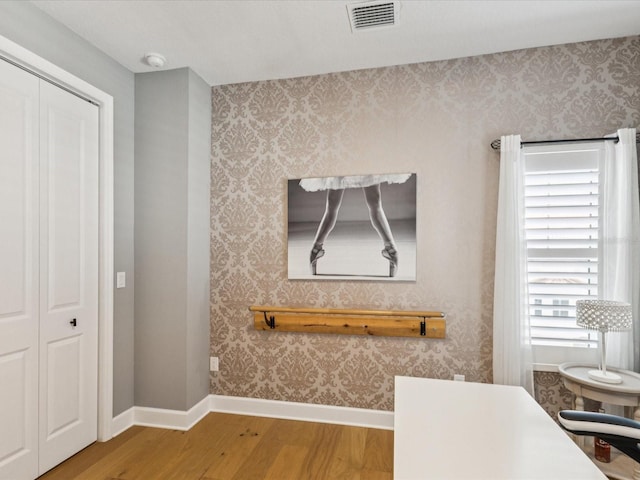 1340 Bayshore Blvd Unit 502, Dunedin, FL 34698 - detailed view of wood finished floors, wallpapered walls, and a smoke detector