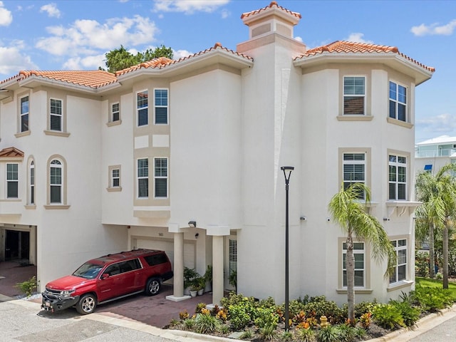 1340 Bayshore Blvd Unit 502, Dunedin, FL 34698 - view of front of property featuring a tiled roof and stucco siding