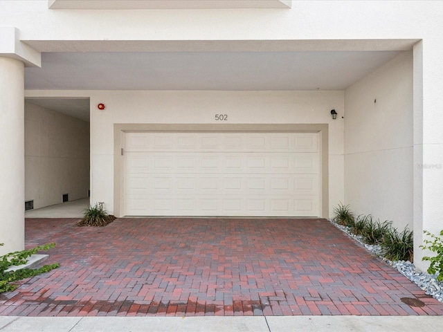 1340 Bayshore Blvd Unit 502, Dunedin, FL 34698 - garage featuring decorative driveway