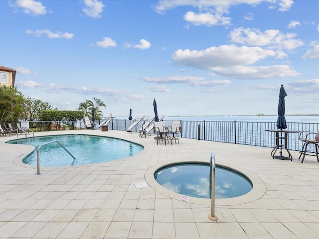 1340 Bayshore Blvd Unit 502, Dunedin, FL 34698 - community pool featuring a patio area and a community hot tub