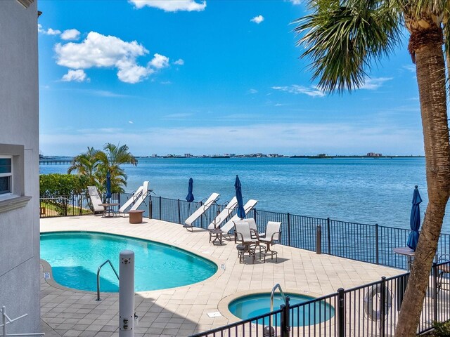 1340 Bayshore Blvd Unit 502, Dunedin, FL 34698 - community pool with a patio area, a community hot tub, and a water view
