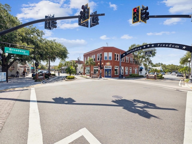 1340 Bayshore Blvd Unit 502, Dunedin, FL 34698 - view of asphalt road with traffic lights, sidewalks, curbs, street lighting, and traffic signs