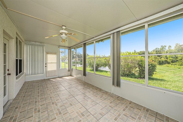 1914 Sassafras Dr, Wesley Chapel, FL 33543 - unfurnished sunroom with a ceiling fan and a water view