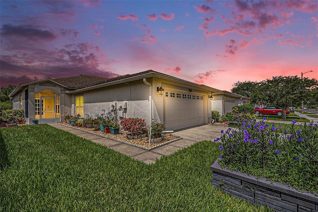 1914 Sassafras Dr, Wesley Chapel, FL 33543 - view of front of property featuring stucco siding, a garage, a lawn, and concrete driveway