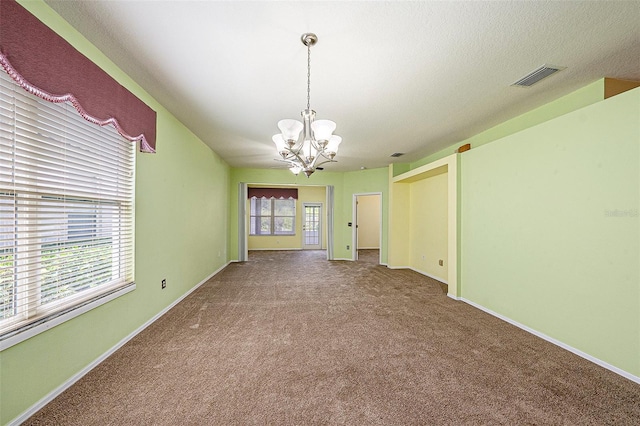 1914 Sassafras Dr, Wesley Chapel, FL 33543 - unfurnished room featuring a chandelier and carpet flooring