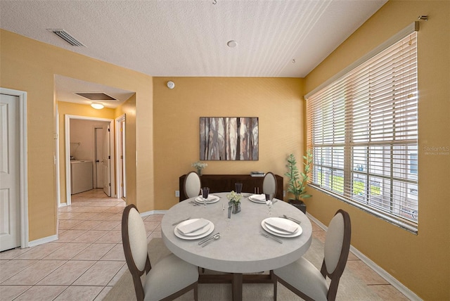 1914 Sassafras Dr, Wesley Chapel, FL 33543 - dining space with light tile patterned floors and a textured ceiling