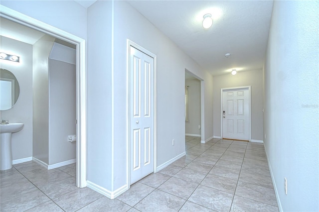 208 English Heritage Pl, Dover, FL 33527 - hall featuring light tile patterned floors and baseboards