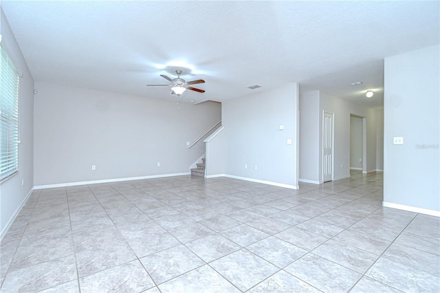 208 English Heritage Pl, Dover, FL 33527 - empty room featuring stairway, a ceiling fan, and light tile patterned flooring