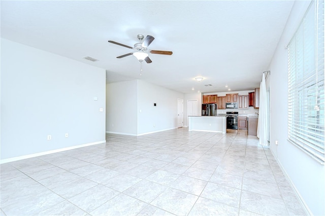 208 English Heritage Pl, Dover, FL 33527 - unfurnished living room featuring a ceiling fan and light tile patterned flooring
