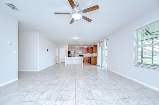 208 English Heritage Pl, Dover, FL 33527 - unfurnished living room with a ceiling fan and light tile patterned floors