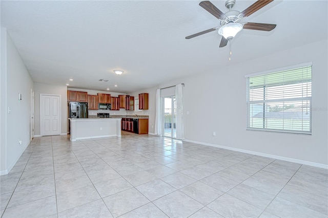 208 English Heritage Pl, Dover, FL 33527 - unfurnished living room featuring light tile patterned floors, a ceiling fan, and recessed lighting