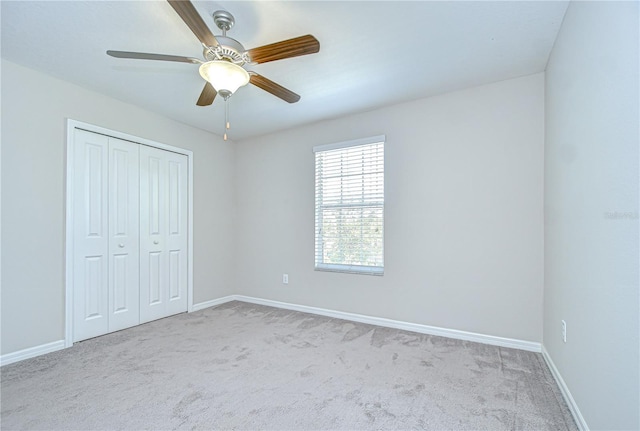 208 English Heritage Pl, Dover, FL 33527 - unfurnished bedroom with carpet, a closet, and a ceiling fan