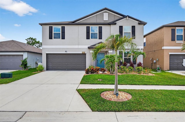 12835 Wildflower Meadow Dr, Riverview, FL 33579 - view of front of house featuring stucco siding, an attached garage, concrete driveway, and a front lawn