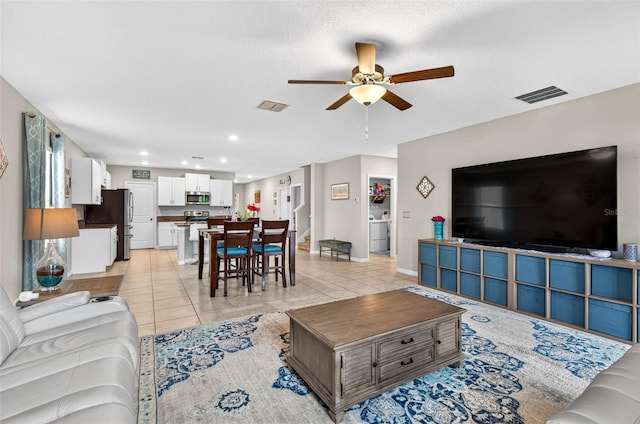 12835 Wildflower Meadow Dr, Riverview, FL 33579 - living area featuring a ceiling fan, light tile patterned floors, recessed lighting, and washer / clothes dryer