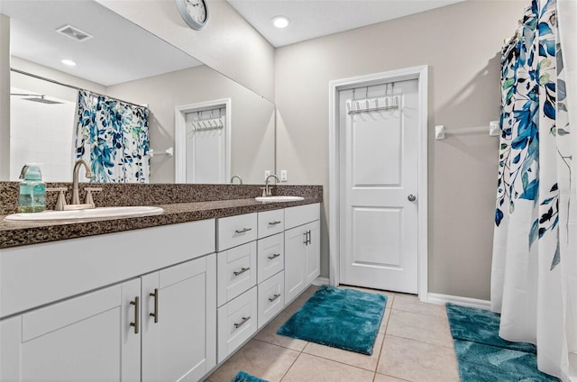 12835 Wildflower Meadow Dr, Riverview, FL 33579 - bathroom with double vanity, tile patterned flooring, and a shower with curtain