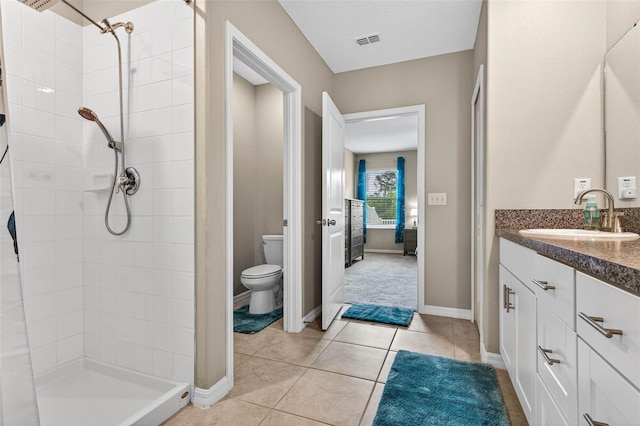 12835 Wildflower Meadow Dr, Riverview, FL 33579 - bathroom featuring a tile shower, vanity, and tile patterned floors