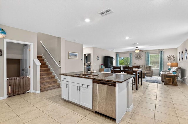 12835 Wildflower Meadow Dr, Riverview, FL 33579 - kitchen featuring dishwasher, open floor plan, light tile patterned floors, dark stone countertops, and recessed lighting