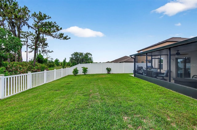 12835 Wildflower Meadow Dr, Riverview, FL 33579 - fenced backyard featuring a sunroom and ceiling fan