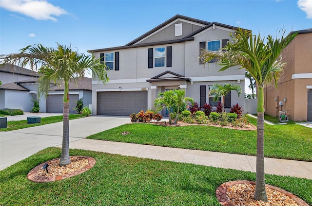 12835 Wildflower Meadow Dr, Riverview, FL 33579 - view of front of house with concrete driveway, stucco siding, a front yard, and a garage