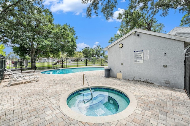5501 67th Ave N Unit 11, Pinellas Park, FL 33781 - community pool featuring a hot tub and a patio area