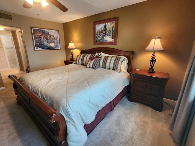 400 64th Ave Unit 1105, St Pete Beach, FL 33706 - bedroom with carpet, ensuite bathroom, and ceiling fan