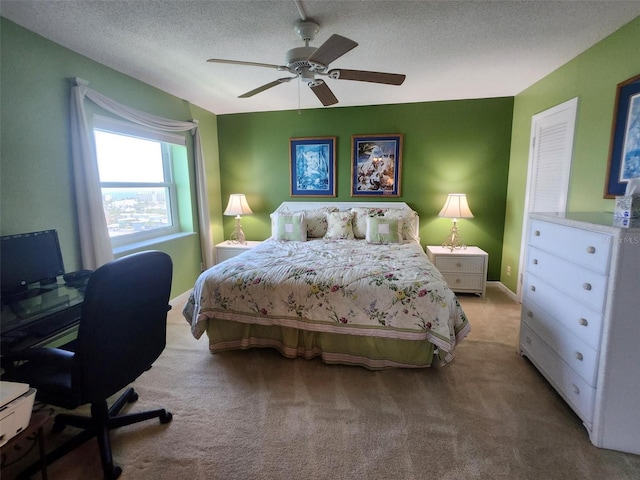 400 64th Ave Unit 1105, St Pete Beach, FL 33706 - carpeted bedroom featuring a textured ceiling, a ceiling fan, and a desk