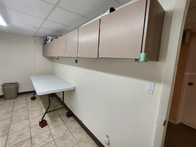 400 64th Ave Unit 1105, St Pete Beach, FL 33706 - laundry room featuring baseboards and light tile patterned flooring