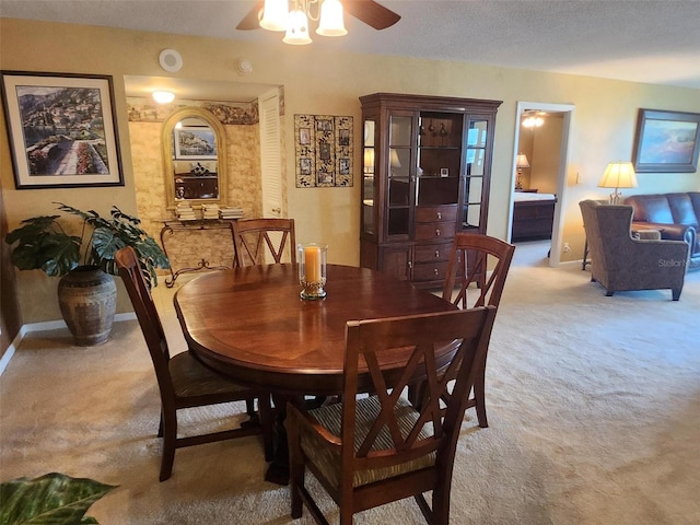 400 64th Ave Unit 1105, St Pete Beach, FL 33706 - dining room featuring carpet and a ceiling fan