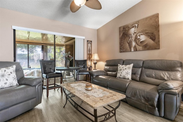 2922 60th St W, Bradenton, FL 34209 - living area featuring ceiling fan, light wood-style floors, and a textured ceiling