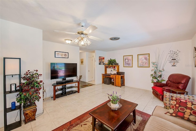 11082 90th Ter, Seminole, FL 33772 - living room featuring light tile patterned flooring and a ceiling fan