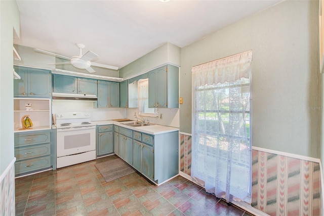 11082 90th Ter, Seminole, FL 33772 - kitchen with white electric range oven, under cabinet range hood, light countertops, and a ceiling fan