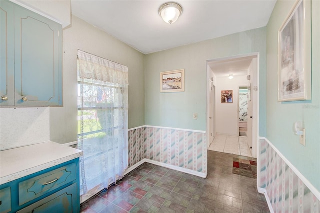 11082 90th Ter, Seminole, FL 33772 - unfurnished dining area featuring wainscoting