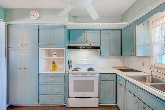 11082 90th Ter, Seminole, FL 33772 - kitchen with electric range, under cabinet range hood, and light countertops
