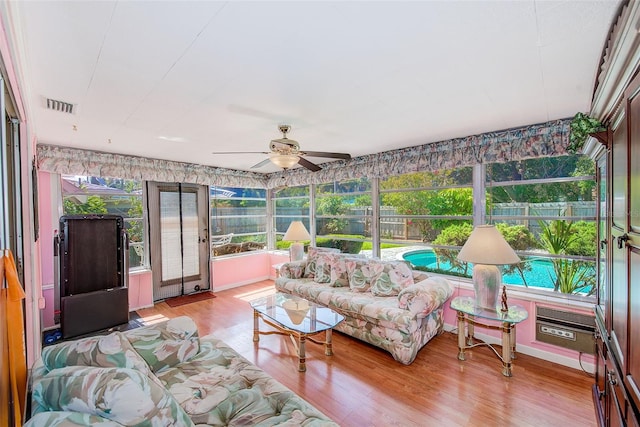 11082 90th Ter, Seminole, FL 33772 - sunroom with ceiling fan, wood finished floors, and healthy amount of natural light