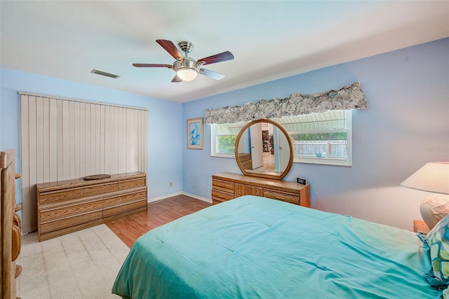 11082 90th Ter, Seminole, FL 33772 - bedroom with wood finished floors and ceiling fan
