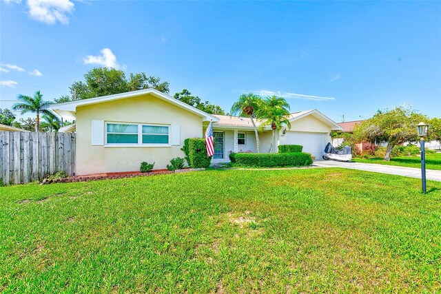 11082 90th Ter, Seminole, FL 33772 - single story home with concrete driveway, stucco siding, and a garage