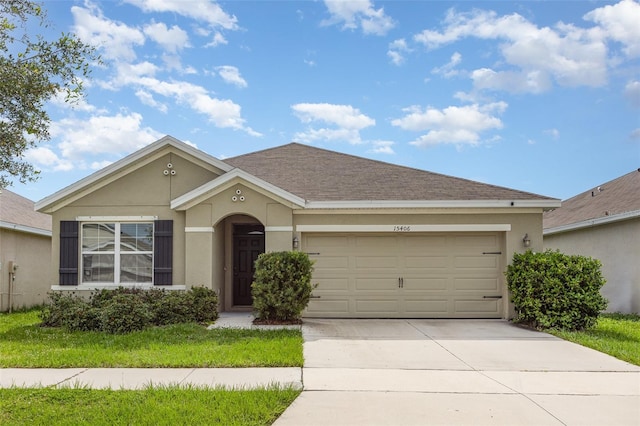 15406 Gopher Trop Pl, Sun City Center, FL 33573 - ranch-style home featuring driveway, a garage, stucco siding, and a shingled roof