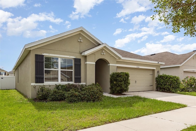 15406 Gopher Trop Pl, Sun City Center, FL 33573 - view of front of property featuring stucco siding, a garage, and driveway