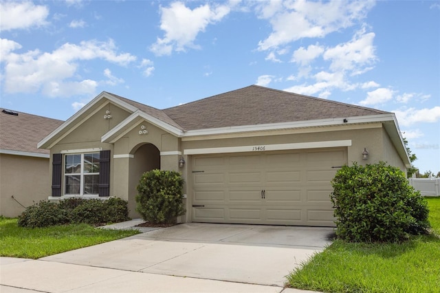 15406 Gopher Trop Pl, Sun City Center, FL 33573 - single story home featuring stucco siding, concrete driveway, an attached garage, and a shingled roof