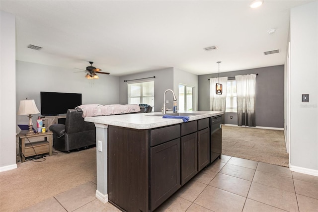 15406 Gopher Trop Pl, Sun City Center, FL 33573 - kitchen featuring light colored carpet, dark brown cabinetry, light countertops, light tile patterned floors, and dishwasher