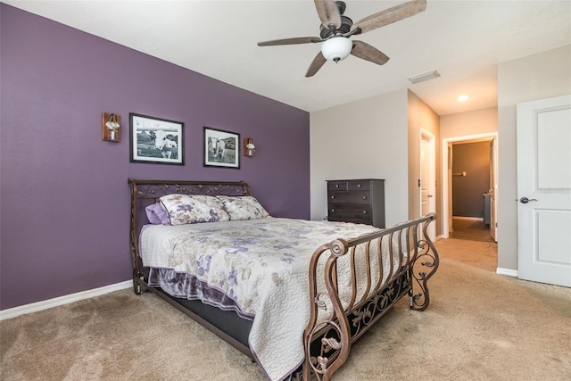 15406 Gopher Trop Pl, Sun City Center, FL 33573 - carpeted bedroom with baseboards and ceiling fan