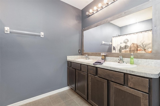 15406 Gopher Trop Pl, Sun City Center, FL 33573 - bathroom with double vanity and tile patterned flooring