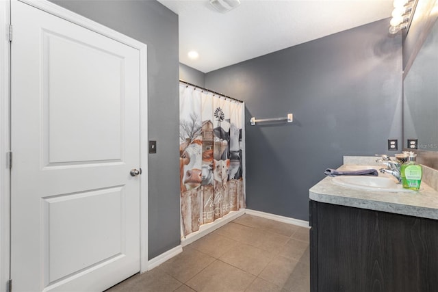 15406 Gopher Trop Pl, Sun City Center, FL 33573 - bathroom with double vanity, tile patterned flooring, and a shower with shower curtain