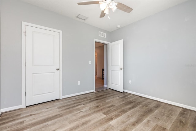 15406 Gopher Trop Pl, Sun City Center, FL 33573 - unfurnished bedroom with wood finished floors and a ceiling fan