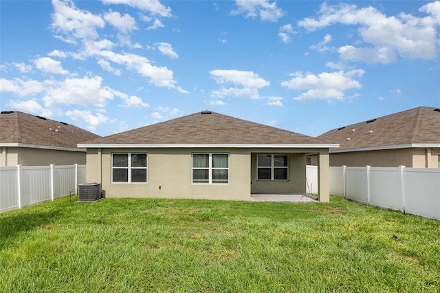 15406 Gopher Trop Pl, Sun City Center, FL 33573 - back of house with stucco siding, a patio, a fenced backyard, and roof with shingles