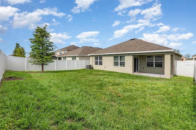 15406 Gopher Trop Pl, Sun City Center, FL 33573 - back of property featuring stucco siding, a patio area, a fenced backyard, and roof with shingles