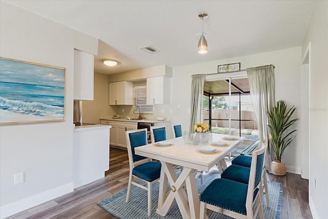 706 E Gate Dr, Safety Harbor, FL 34695 - dining area with wood finished floors