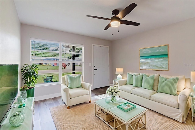 706 E Gate Dr, Safety Harbor, FL 34695 - living room with a ceiling fan and wood finished floors